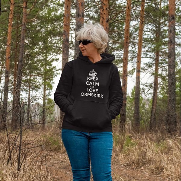 A Photograph of a lady in the woods wearing a hoodie with the words Keep Calm and Love Ormskirk Printed on the front