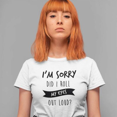 A Photograph of a red haired woman wearing a T Shirt with the words im sorry did i roll my eyes out loud printed on the front